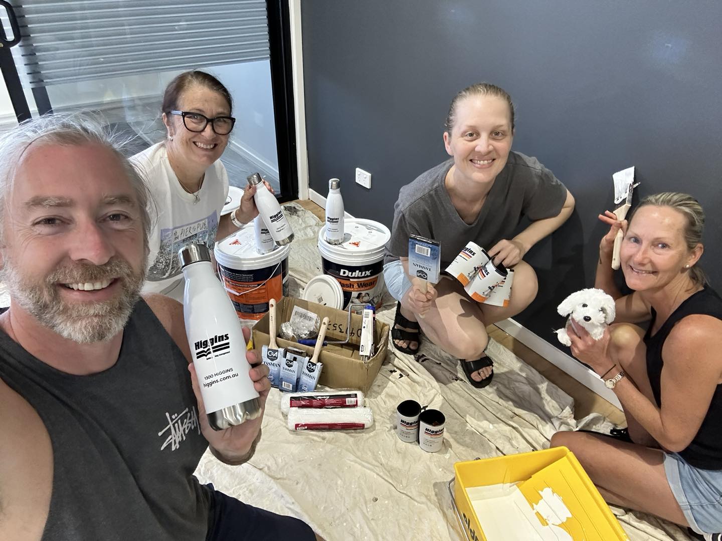 Ashton and his team painting their new office